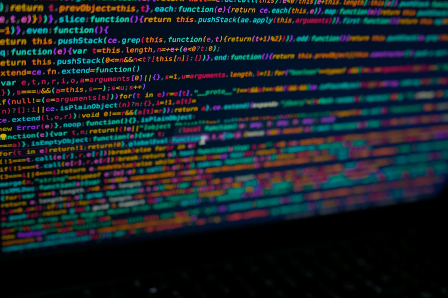 Computer screen displaying colorful lines of JavaScript code.
